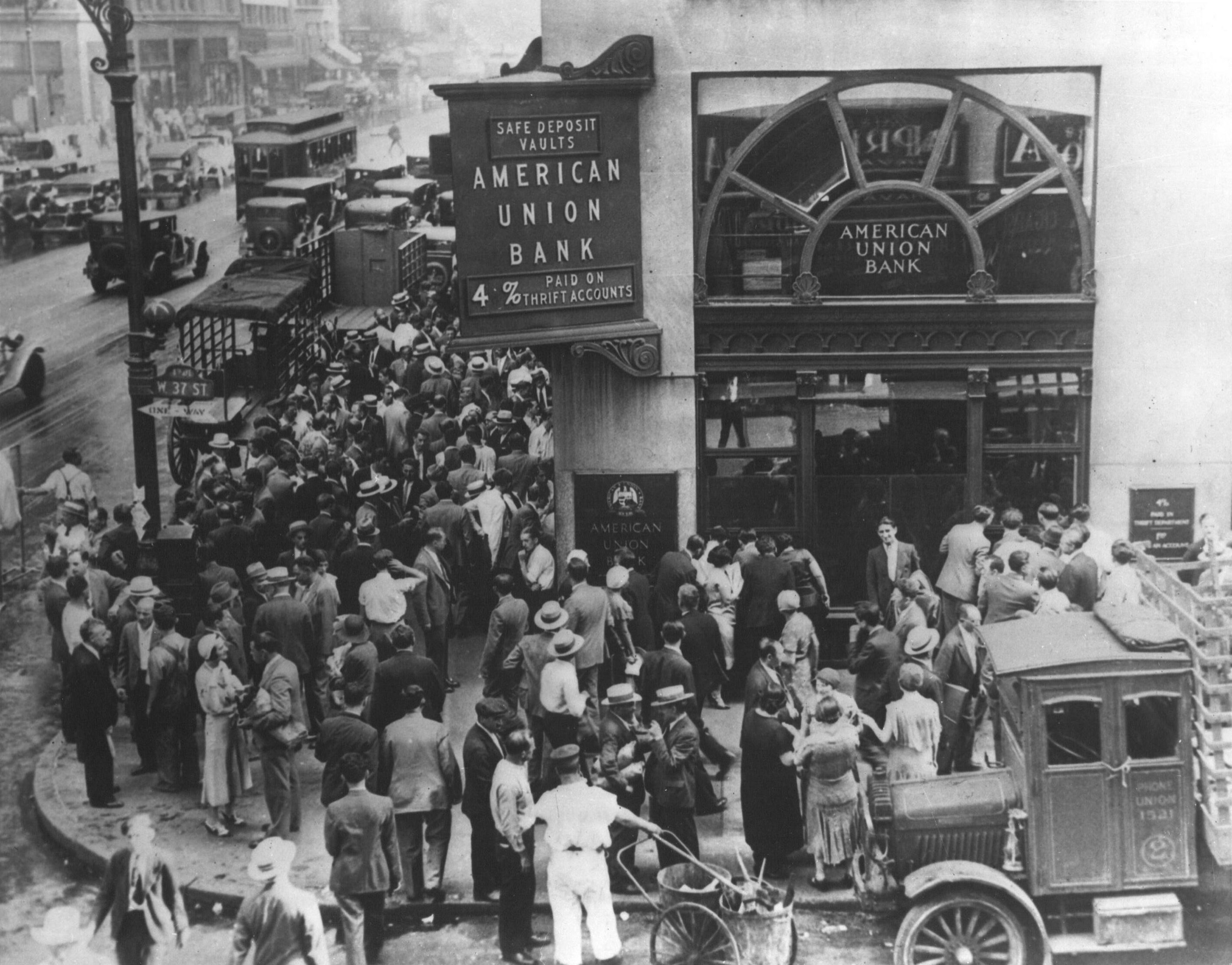 A dense crowd of depositors gathered outside the American Union Bank during a bank run.