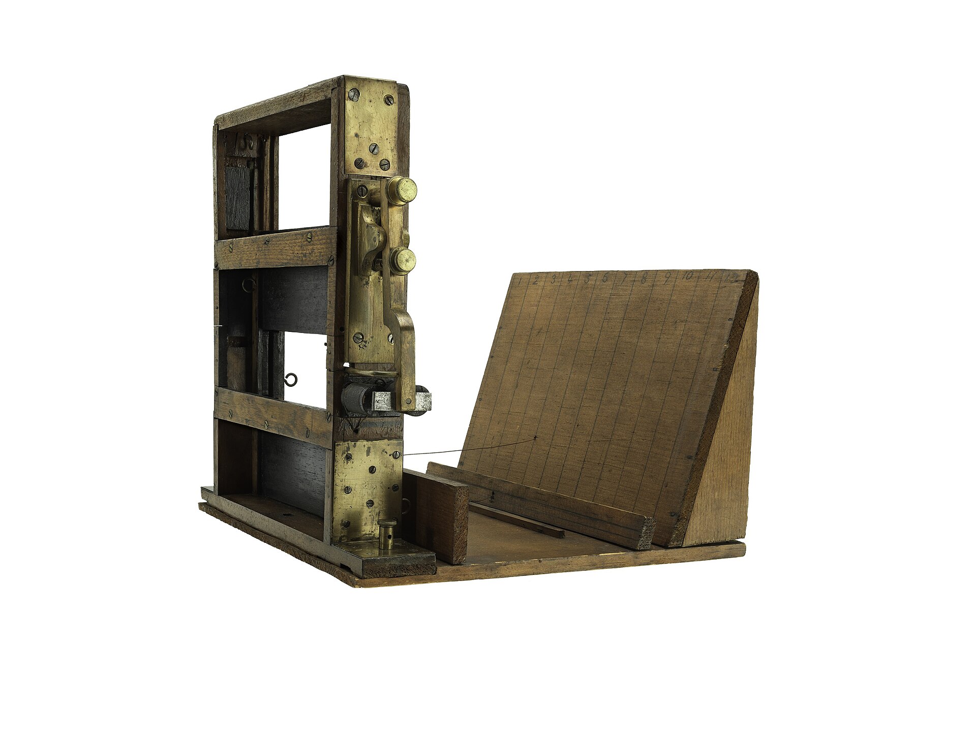 Wood-and-brass nineteenth-century apparatus used to photograph objects at measured positions during motion.