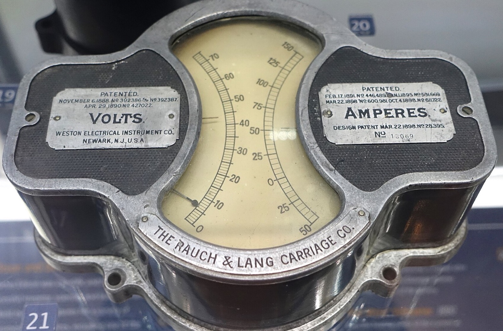 Historic Weston electrical instrument with separate volts and amperes scales around one pointer.