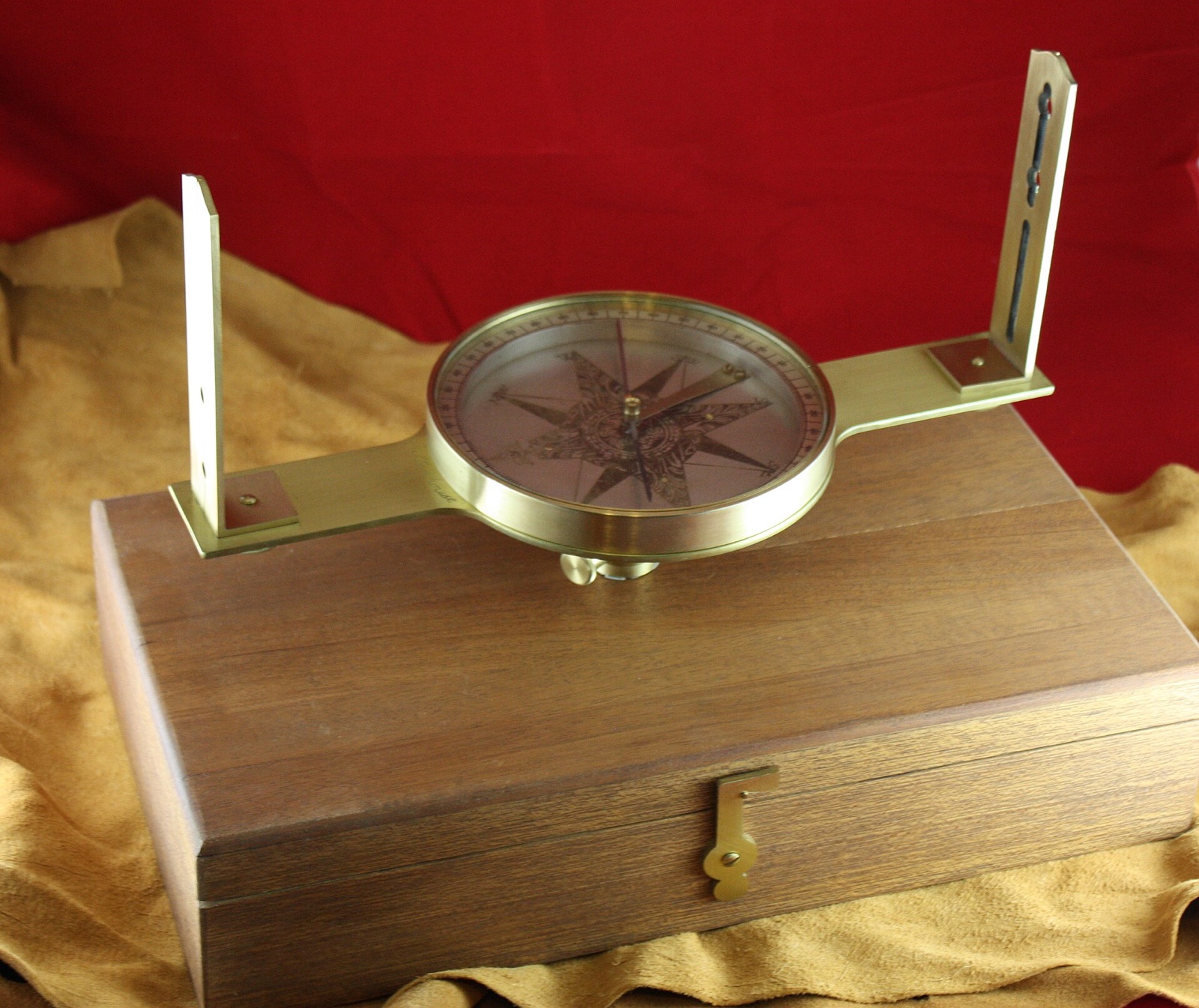 Historic circumferentor with a magnetic compass, sighting vanes, leveling hardware, and circular scale.