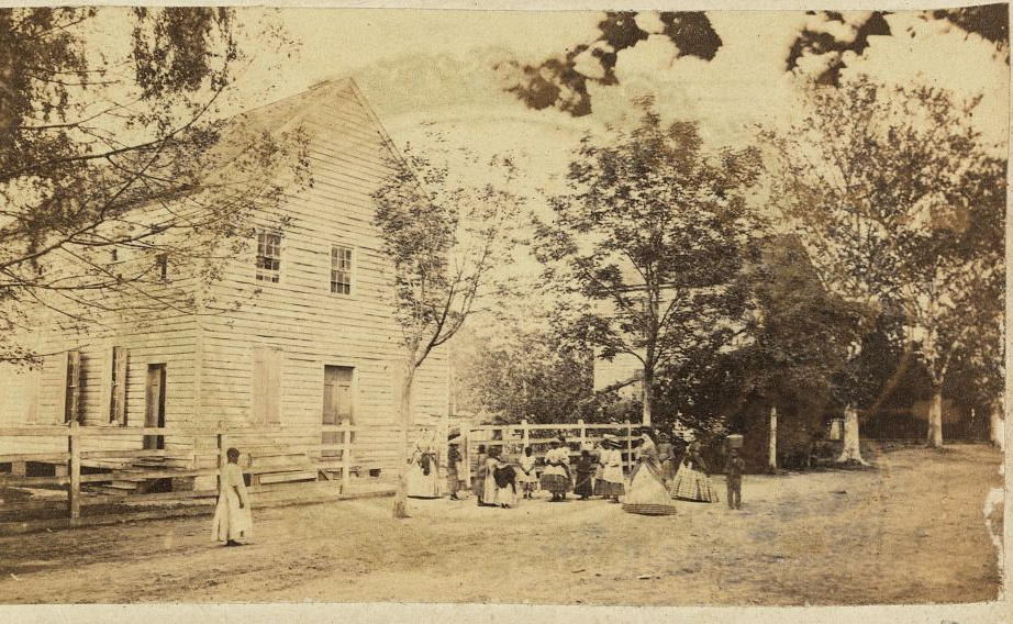 Nineteenth-century classroom with Black students and teachers during Reconstruction
