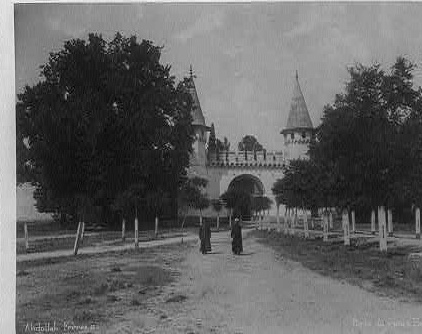 Framed historic photograph of a tree-lined approach to the Imperial Gate of Topkapi Palace